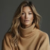 Woman is wearing a pullover and smiling ans saying hello to you